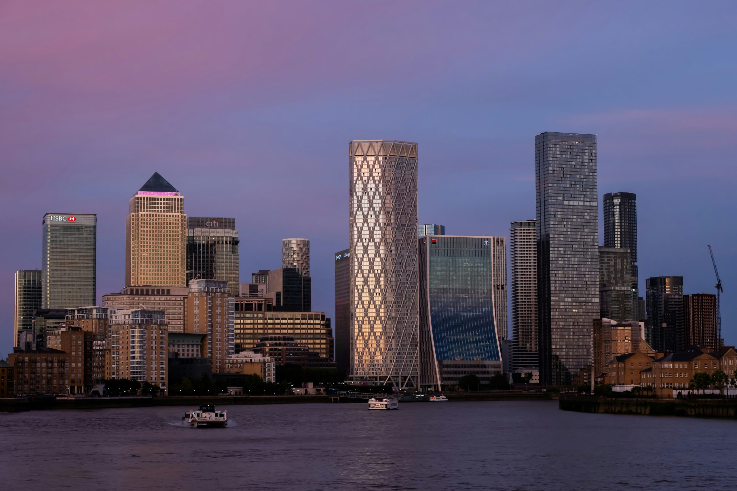 Commercial buildings in a city district, reflecting investor focus on energy risk and asset value